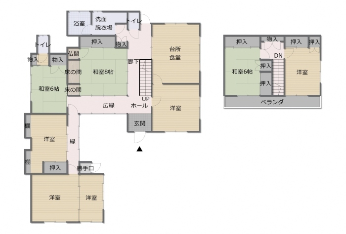 トイレが2箇所、6帖和室が2部屋、8帖和室が1部屋、台所兼食堂、洋室が5部屋、浴室、ベランダなどの位置を示した2階建ての間取り図